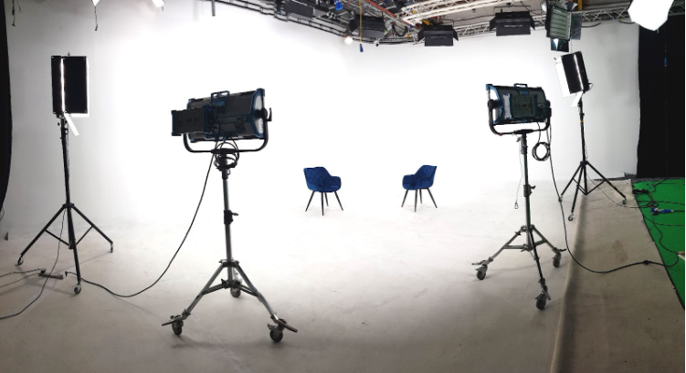 Wide-angle view of a white infinity cove studio in London with professional lighting setup White Infinity Cove Studio in London for Seamless Visual Productions