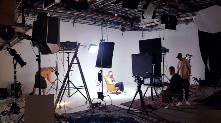 Camera crew filming a model in a white infinity cove studio in London Professional White Infinity Cove Studio Hire in London