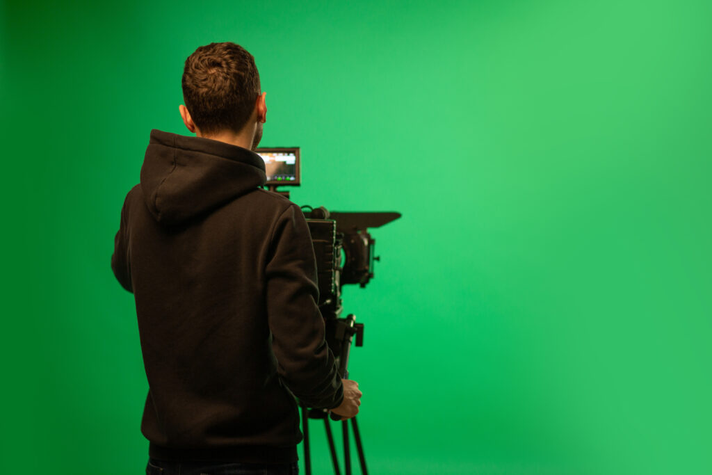 Director consulting legal advisor about UK filming permits and compliance on set