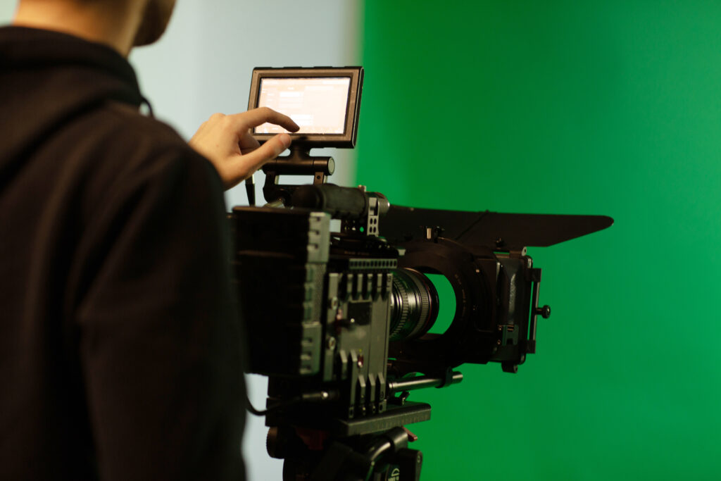 Film crew on UK set discussing legal requirements for studio and location filming
